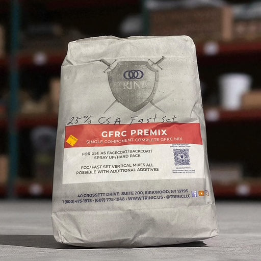 Bag of TRIN GFRC Premix on a wooden surface with blurred storage shelves in the background